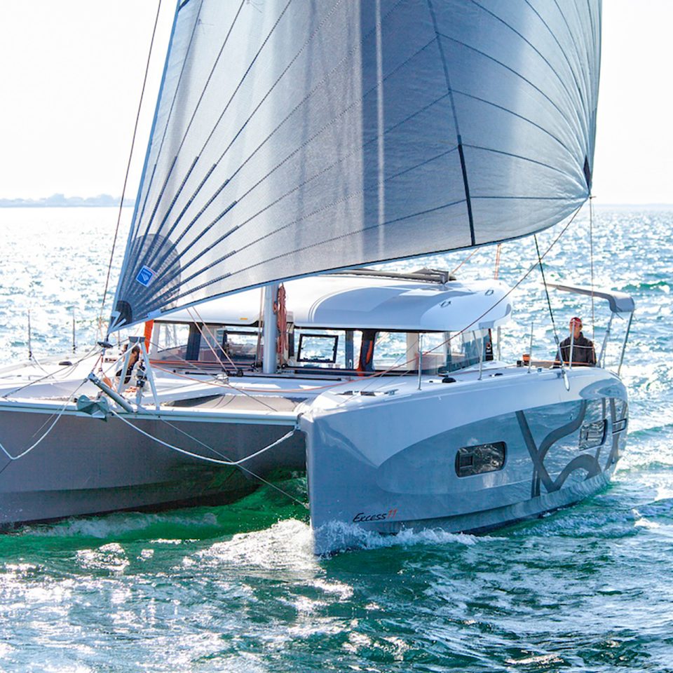 Sailing Excess 11 yacht with man at helm