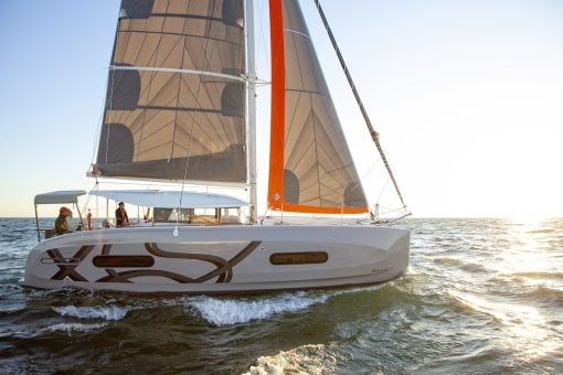 Excess 11 sailing at sunset