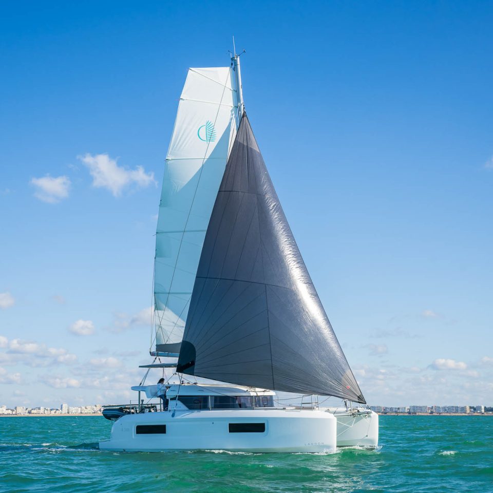 Side view of Lagoon 38 Catamaran sailing in the sea