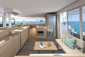Salon seating and kitchen aboard the Lagoon 38 catamaran